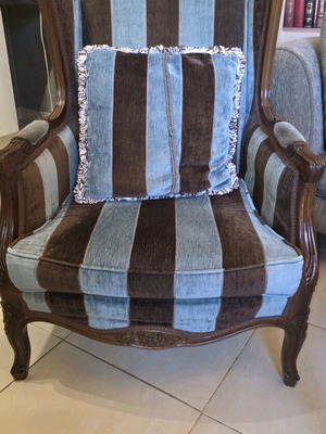 Pair of classic wingback armchairs with striped fabric