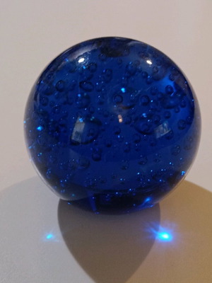 Glass paperweight used, round deep blue with bubbles