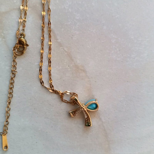 Necklace with silver-plated chain and bow design with turquoise stone like new