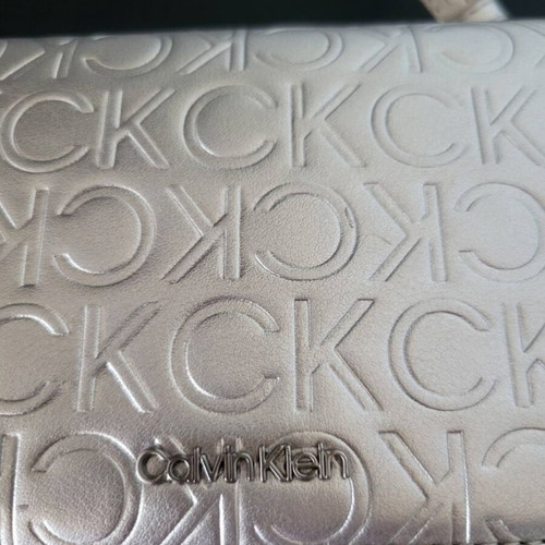 Calvin Klein silver bag like new with logo