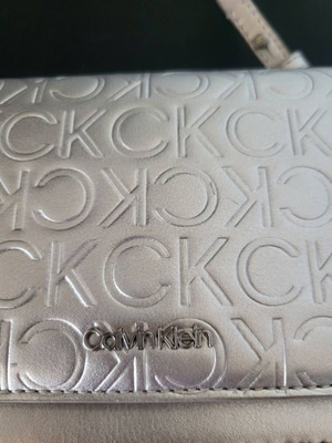 Calvin Klein silver bag like new with logo