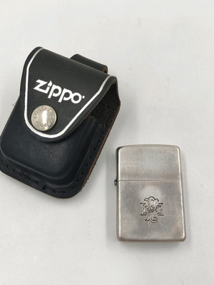 Zippo silver lighter used with leather case