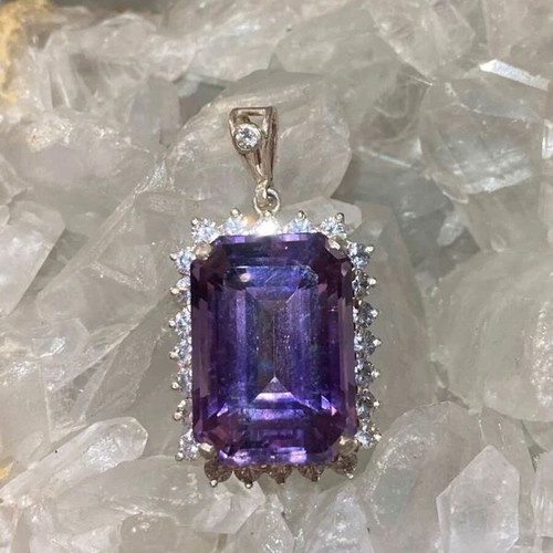 Silver pendant with large cut natural amethyst stone and moissanites