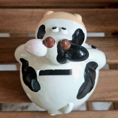 Ceramic cow piggy bank like new, black and white