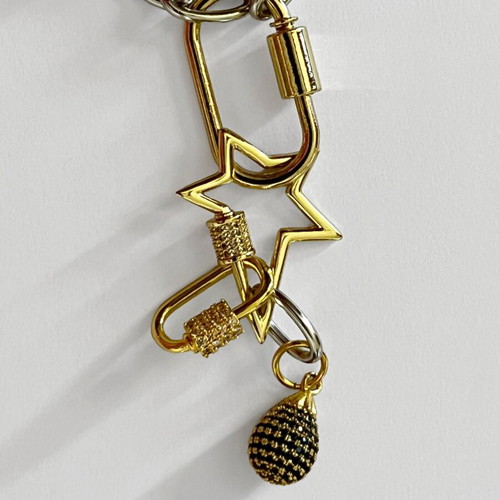 Long pendant with silver chain and gold rings, star and diamond-shaped drop