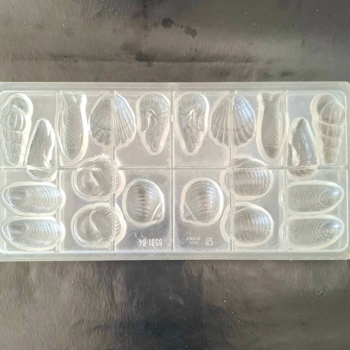 Polycarbonate chocolate mold used, summer shell and fish designs