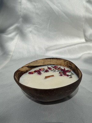 Handmade soy candle in natural coconut with dried flowers