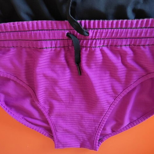 Reebok women's PlayDry ZigTech running shorts used, black and purple, size M