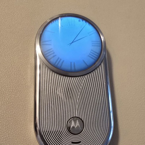 Motorola Aura phone like new, silver with spare battery and charger