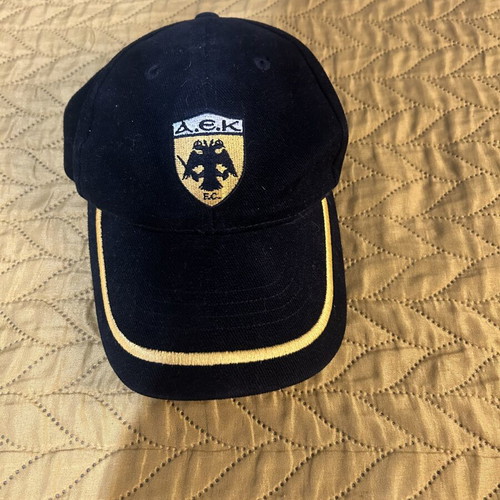 AEK Champions League hat used, adjustable, black and yellow