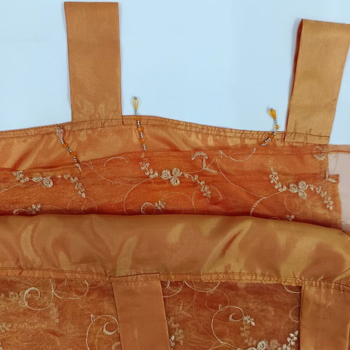 Orange organza curtain like new with beads