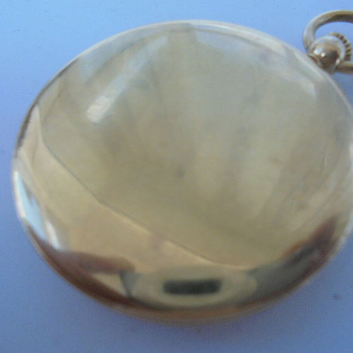 Dugena pocket watch quartz like new, gold color with chain