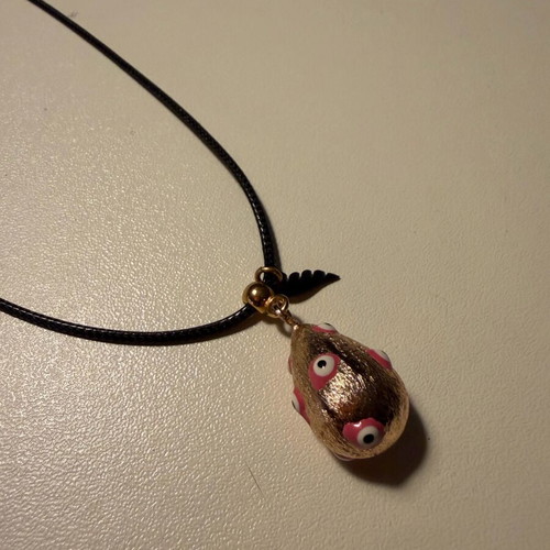 Easter egg pendant like new with leather cord