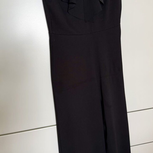 Jumpsuit with ruffles one size like new, black