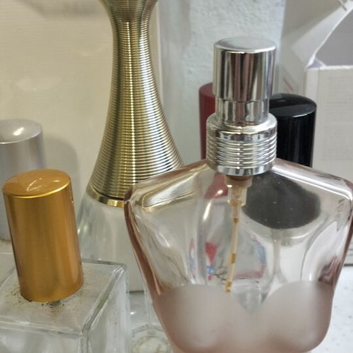 Empty perfume bottles used, including Jadore Dior and Jean Paul Gaultier