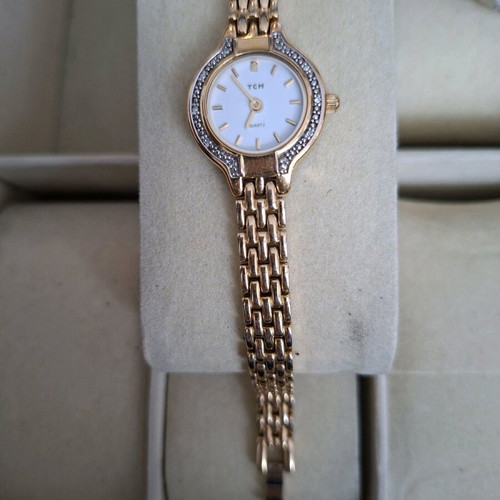 TCM women's watch used, gold-tone with minor scratch on glass