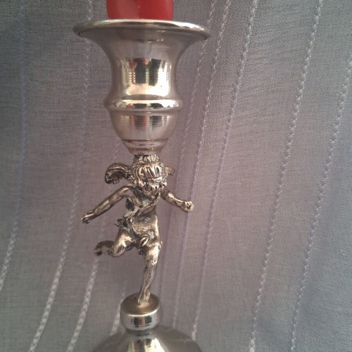 Vintage candlestick with cherub figure