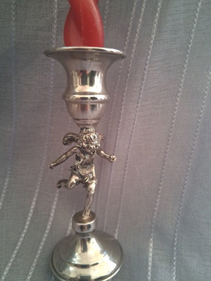 Vintage candlestick with cherub figure