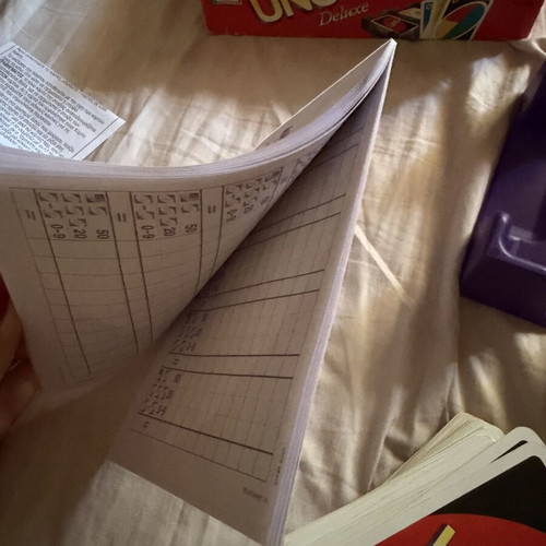 Uno Deluxe card game used with base and score notebook