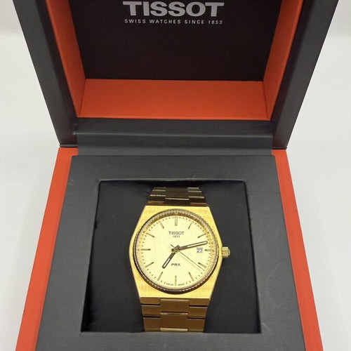 Tissot PRX Quartz watch with golden dial