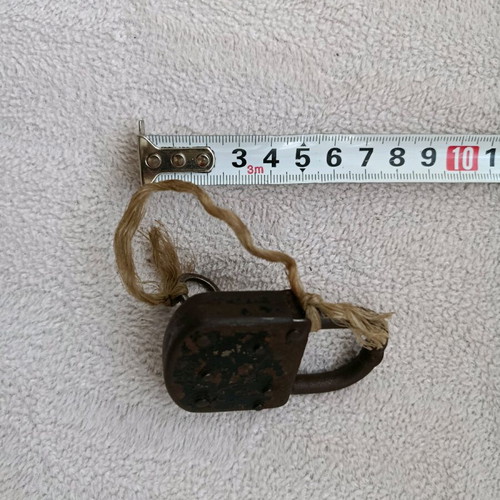 Old padlock with key used, does not unlock or lock
