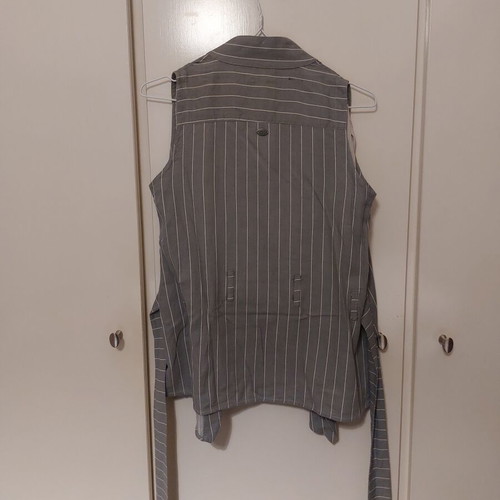 Namaste vest with beige pants like new