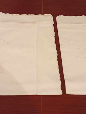 Figured pillowcases new, white with white embroidery
