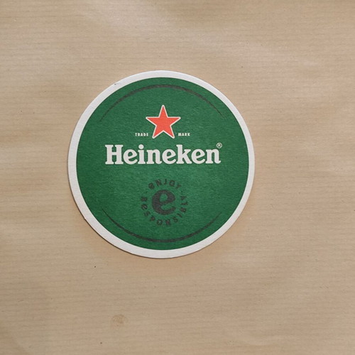 Heiniken brewery coaster new with 2 soda labels