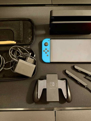 Nintendo Switch OLED употребяван с калъф и 256GB карта памет