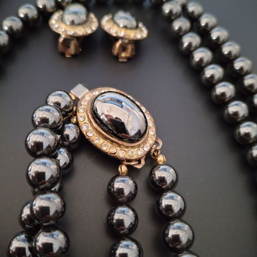 Vintage jewelry set used with black glossy beads and zircon
