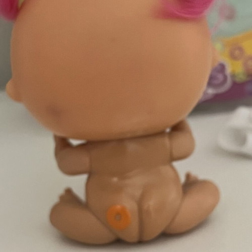 The Bellies Mini Yummy doll used, pink hair, orange bows