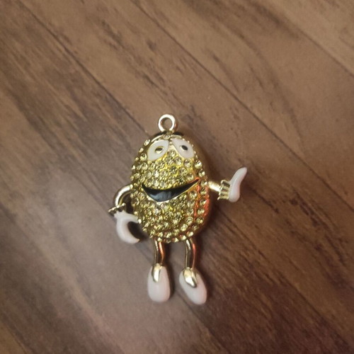 The Smiling Child pendant necklace like new, gold with white enamel
