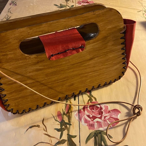Wooden handmade bag with red leather stitched by hand