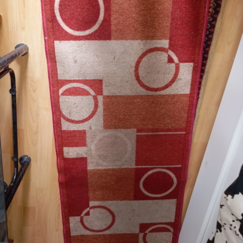 Vintage carpet runner used with geometric motifs in warm colors
