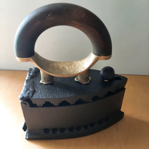 Charcoal iron used from 1920-30 with thorough restoration