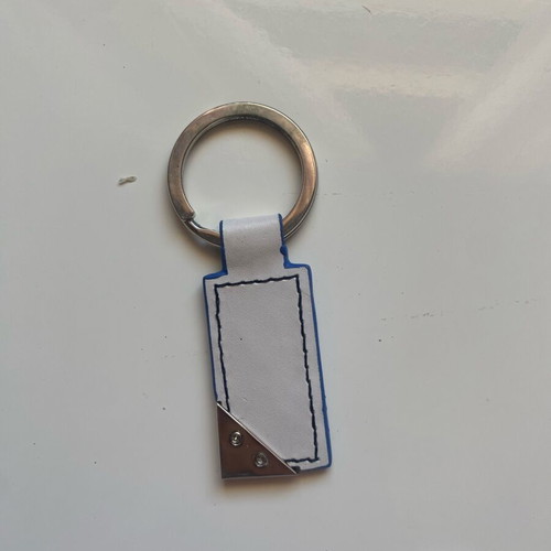 Benetton keychain like new, white and blue