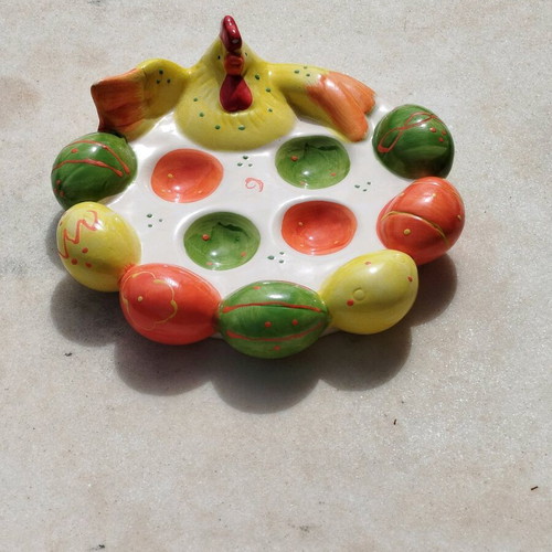 Chicken egg holder with colorful eggs in porcelain new for festive table
