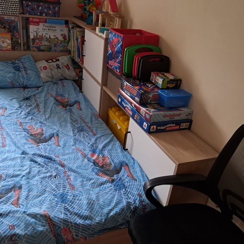 Children's bed used with bookshelf and storage drawer