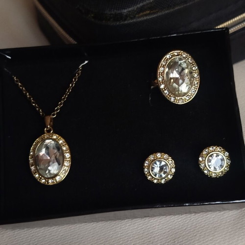 Avon jewelry set with gold color, rhinestones and stones, steel