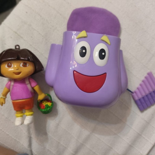 Dora the Explorer figures used, including backpack and magic flute