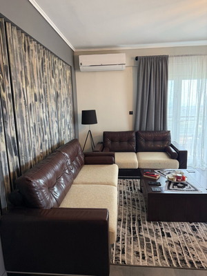 Living room set like new with leather three-seater and two-seater sofas