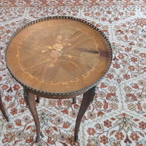 Antique marquetry table used with bronze garland