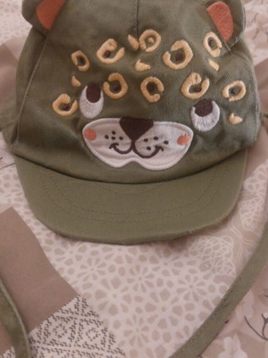 Baby hat with animal design used, for 6–12 months