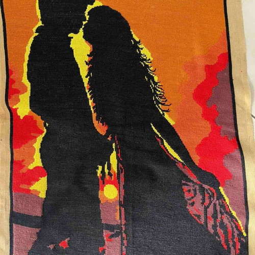 Handmade embroidered textile painting like new, silhouette of a couple at sunset