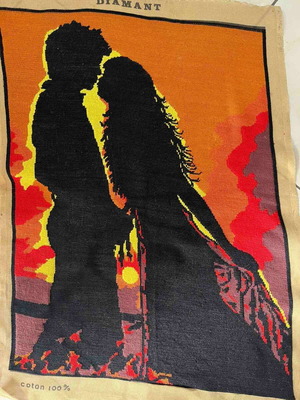 Handmade embroidered textile painting like new, silhouette of a couple at sunset