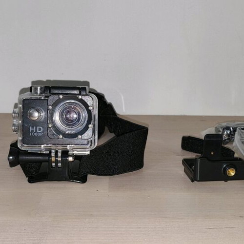 Action camera like new with waterproof case and mounting accessories