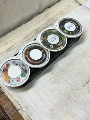 PSP UMD discs used, pack of 4 titles with wear, untested