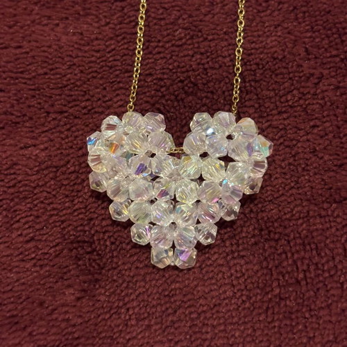Gold necklace with crystal heart pendant