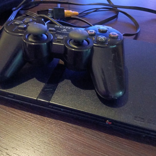Sony PlayStation 2 console with memory card and remote
