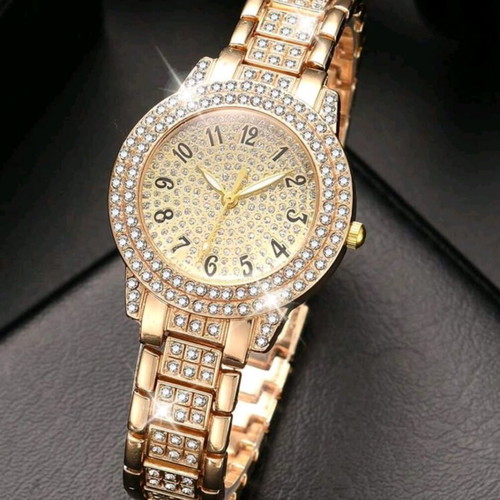 Women's wristwatch new with crystals, yellow gold
